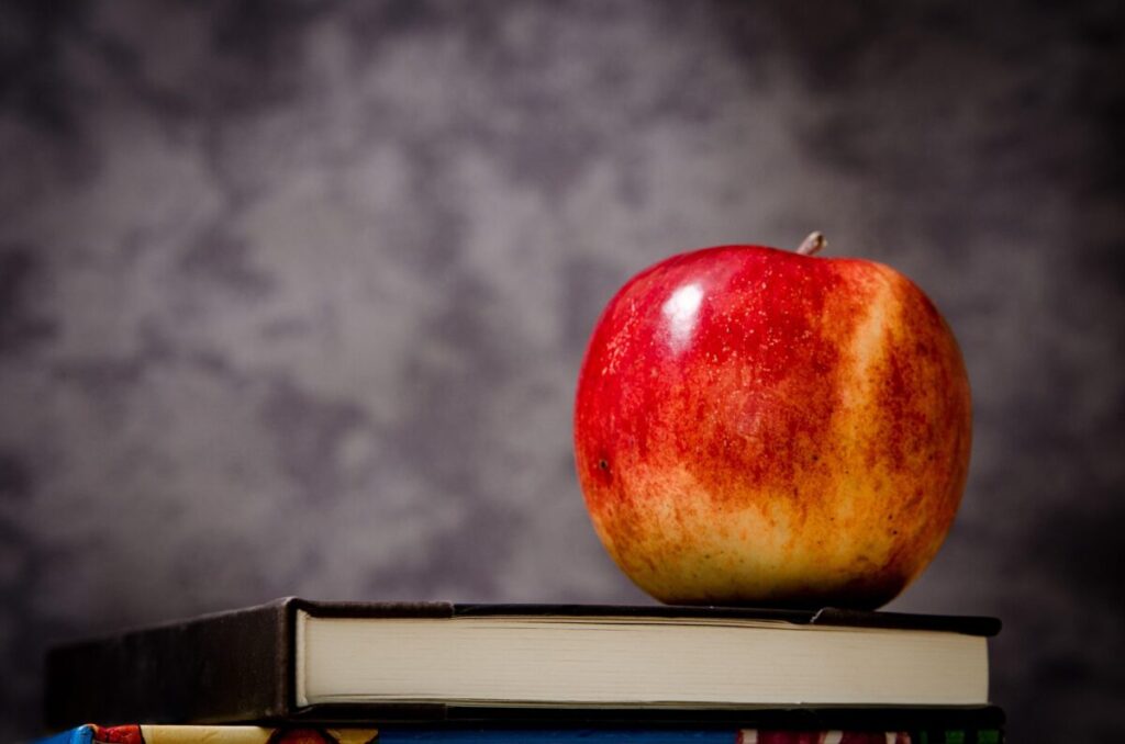 Apple on a book